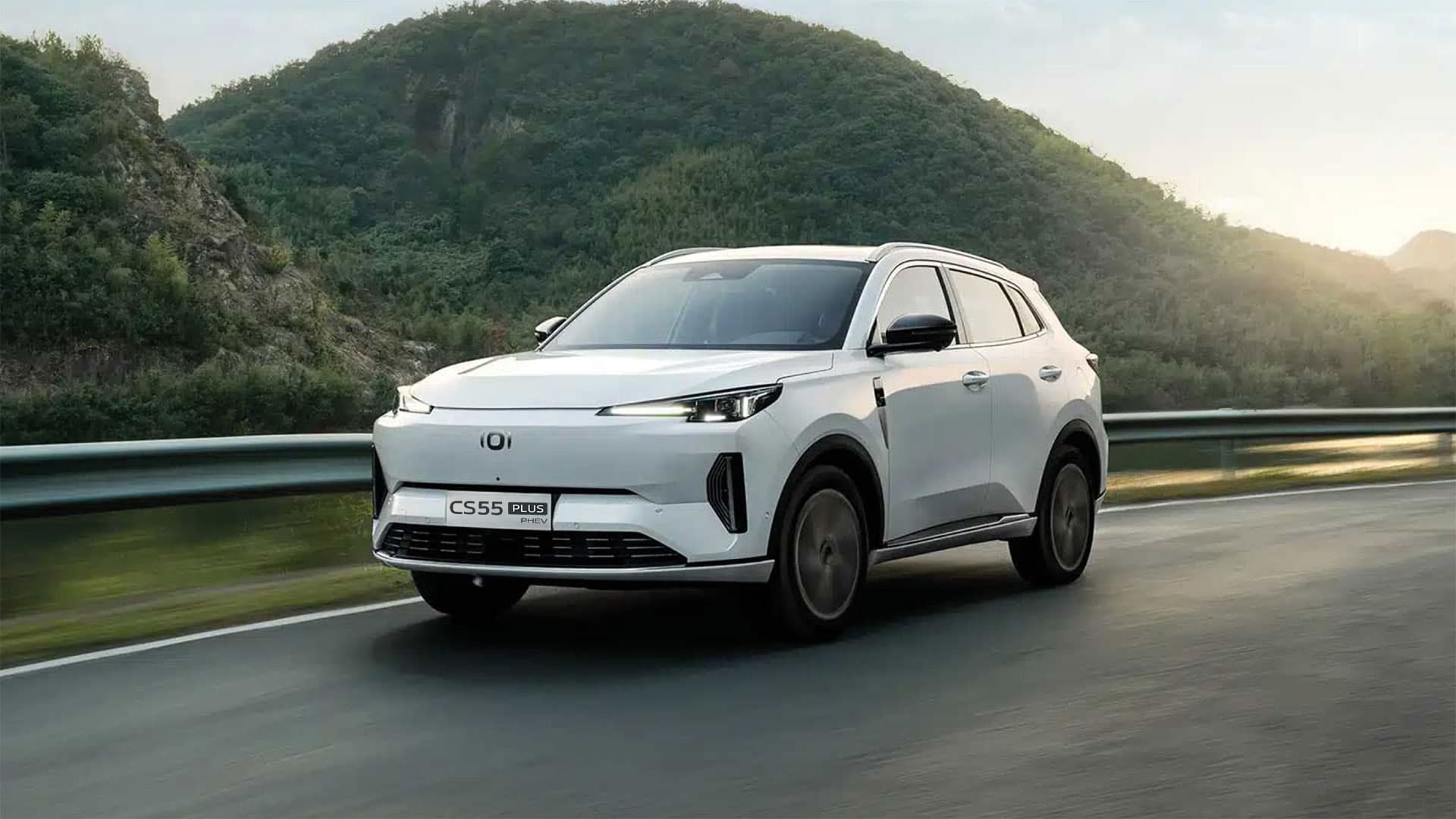 Close-up of a modern car's front grille with intricate patterns.